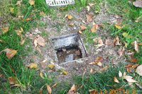 Drain surrounded by dirt